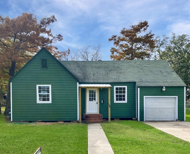 547 Trinity Ave, Port Arthur, TX 77640 - view of front of property with a front lawn, concrete driveway, roof with shingles, and a garage