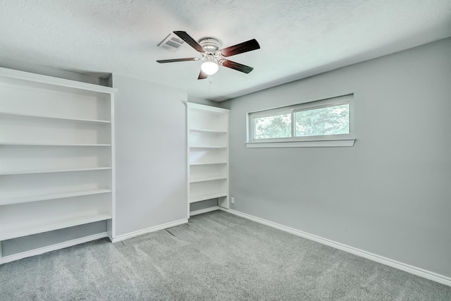 175 Triangle Dr, Vidor, TX 77662 - unfurnished bedroom featuring carpet, baseboards, a textured ceiling, and a ceiling fan