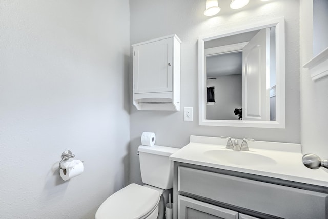 175 Triangle Dr, Vidor, TX 77662 - half bathroom featuring toilet and vanity