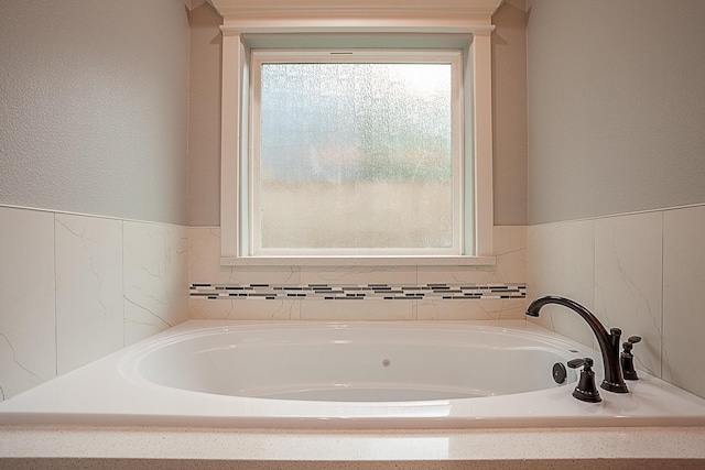 7495 Broussard Rd, Beaumont, TX 77713 - full bathroom with a bath and a textured wall