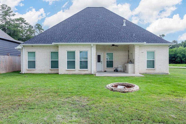 7495 Broussard Rd, Beaumont, TX 77713 - back of property with an outdoor fire pit, a patio, ceiling fan, roof with shingles, and brick siding