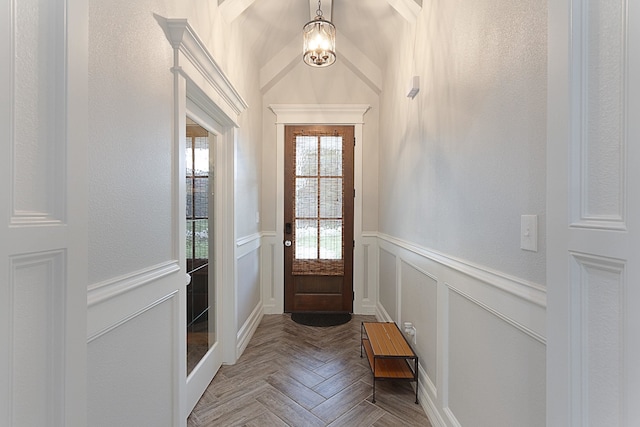 7495 Broussard Rd, Beaumont, TX 77713 - doorway with wainscoting and a decorative wall