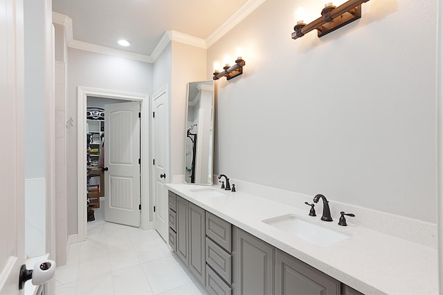 7495 Broussard Rd, Beaumont, TX 77713 - bathroom featuring ornamental molding, double vanity, a spacious closet, marble finish flooring, and recessed lighting