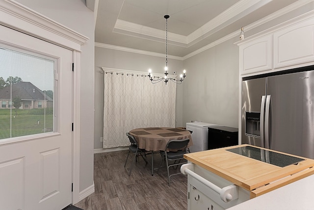 7495 Broussard Rd, Beaumont, TX 77713 - kitchen with wood counters, dark wood-type flooring, stainless steel fridge with ice dispenser, a chandelier, and white cabinets