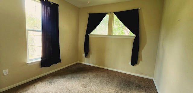 unfurnished room with carpet floors