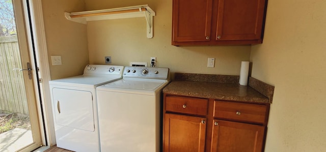 laundry area featuring cabinets and independent washer and dryer