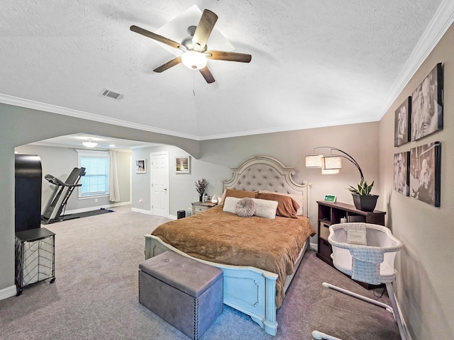 bedroom featuring crown molding, arched walkways, a textured ceiling, and visible vents