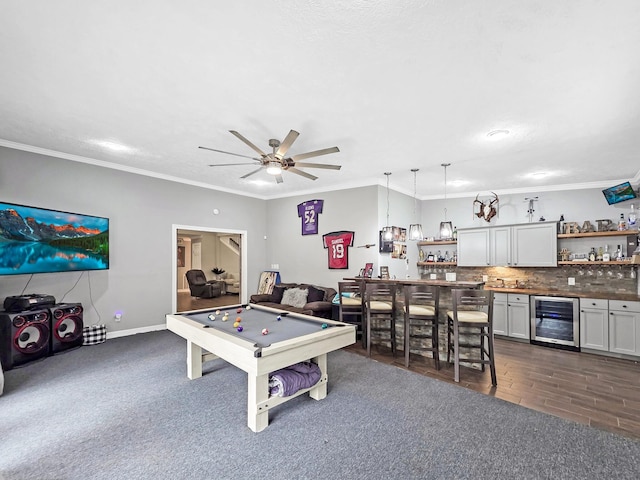 game room with beverage cooler, a ceiling fan, pool table, wet bar, and ornamental molding