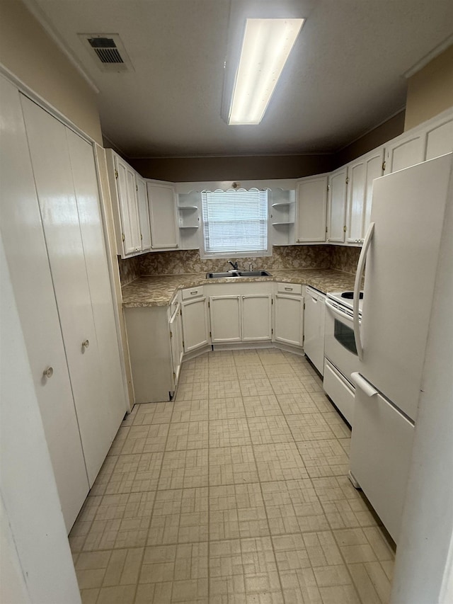 kitchen with white cabinetry, white appliances, visible vents, and open shelves