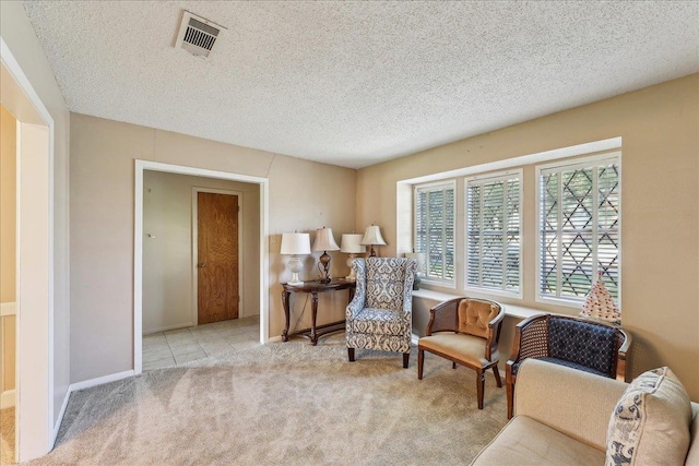 1004 Louise Dr, Nederland, TX 77627 - sitting room featuring visible vents, baseboards, carpet floors, and a textured ceiling