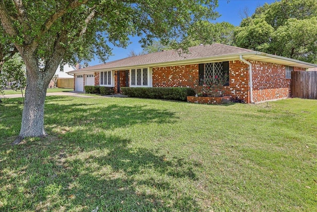 1004 Louise Dr, Nederland, TX 77627 - ranch-style home featuring concrete driveway, a front lawn, brick siding, a garage, and fence