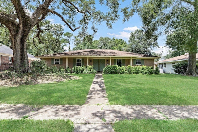 ranch-style house with a front lawn