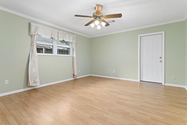 empty room featuring ceiling fan, ornamental molding, and light hardwood / wood-style flooring