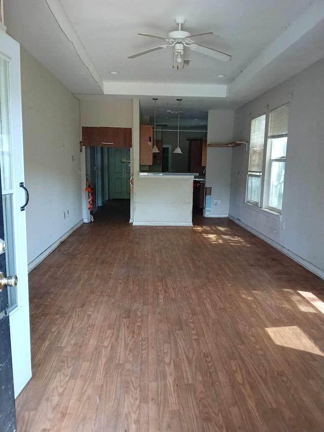 320 W Railroad Ave, China, TX 77613 - unfurnished living room featuring a ceiling fan, wood finished floors, and a tray ceiling