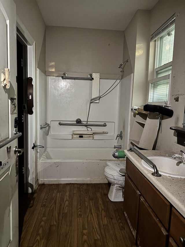 320 W Railroad Ave, China, TX 77613 - full bath featuring wood finished floors, vanity, and shower / bathtub combination