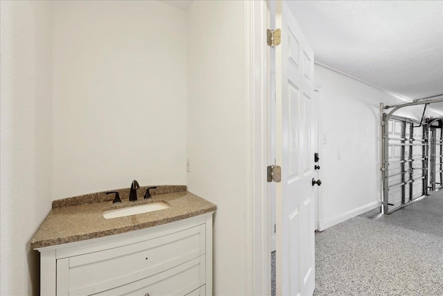 bathroom with vanity and baseboards