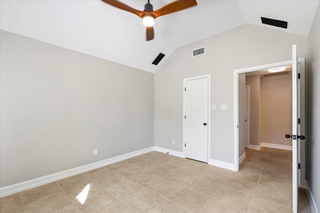 unfurnished bedroom featuring light tile patterned floors, baseboards, visible vents, lofted ceiling, and ceiling fan