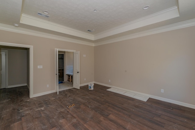 unfurnished bedroom with crown molding, a raised ceiling, and dark hardwood / wood-style floors