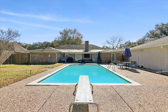 5880 Longwood St, Beaumont, TX 77707 - view of swimming pool with a patio area and a diving board