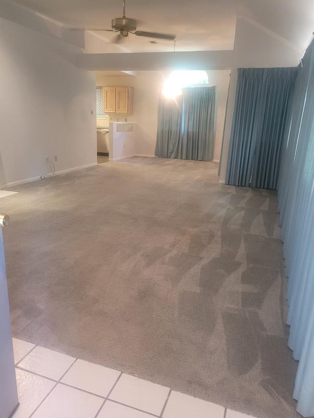 empty room with light colored carpet and ceiling fan