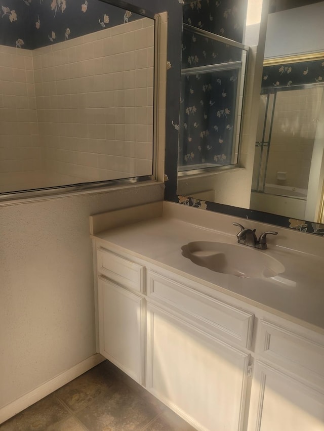 bathroom with tile patterned floors and vanity