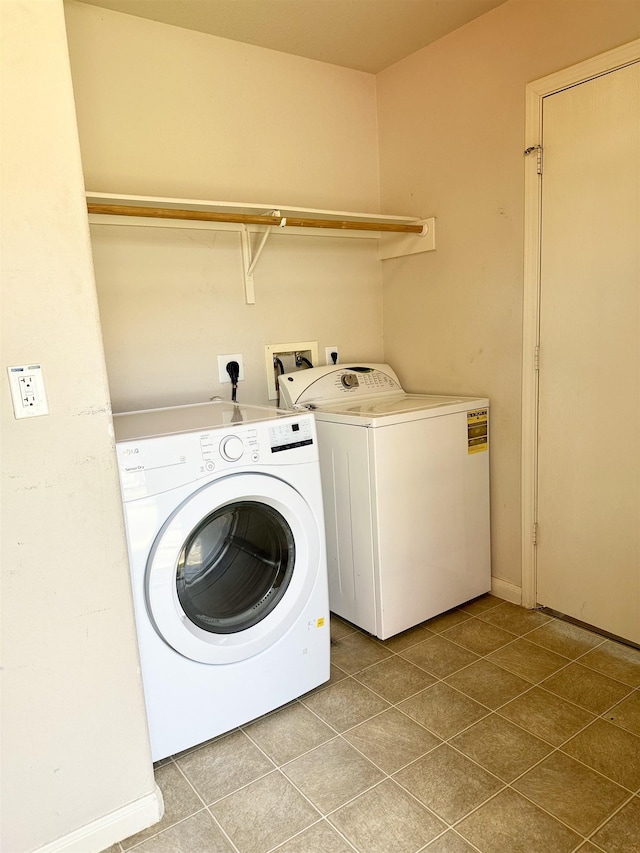 clothes washing area with washing machine and clothes dryer