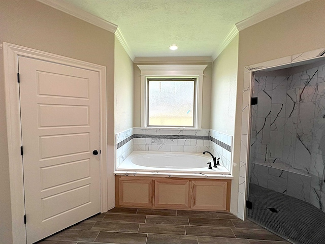 full bath featuring a stall shower, a garden tub, crown molding, and wood tiled floor