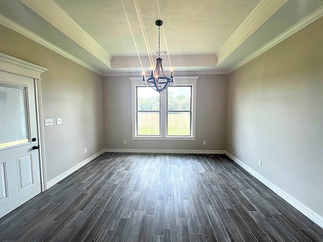 unfurnished room featuring a tray ceiling, dark wood-type flooring, and baseboards