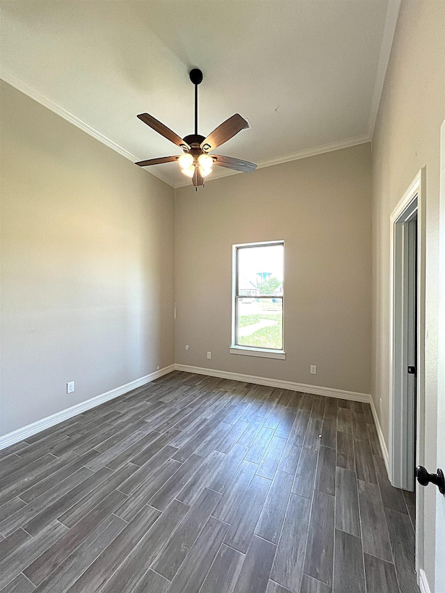 empty room featuring ceiling fan, baseboards, ornamental molding, and dark wood finished floors