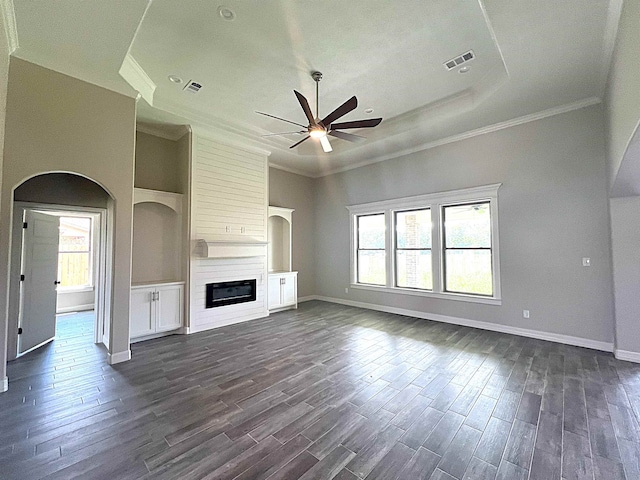 unfurnished living room featuring a fireplace, dark wood finished floors, and visible vents