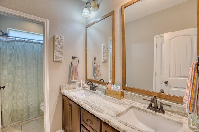 232 Spring Brook Ct, Lumberton, TX 77657 - full bath with toilet, double vanity, and tile patterned floors
