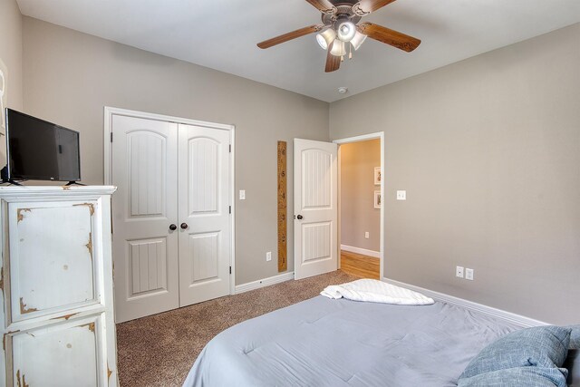 232 Spring Brook Ct, Lumberton, TX 77657 - carpeted bedroom featuring a closet, baseboards, and a ceiling fan