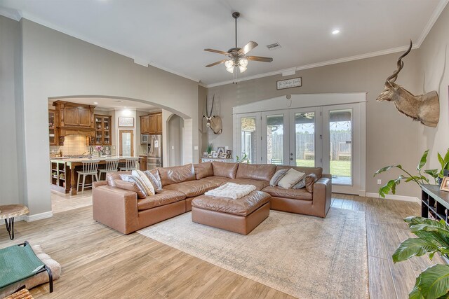 232 Spring Brook Ct, Lumberton, TX 77657 - living area with arched walkways, ceiling fan, light wood-style floors, ornamental molding, and recessed lighting