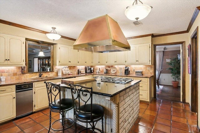 kitchen featuring a kitchen breakfast bar, island range hood, sink, a kitchen island, and stainless steel gas stovetop