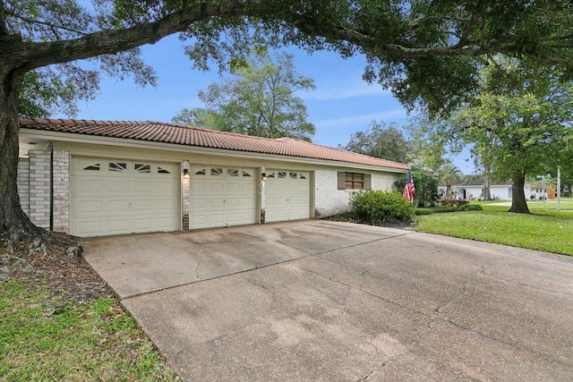 exterior space featuring a yard and a garage