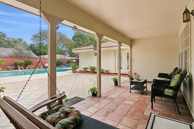 view of patio / terrace with a fenced in pool