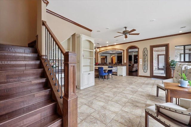 970 Hibiscus Cir, Beaumont, TX 77706 - staircase featuring recessed lighting, crown molding, arched walkways, and ceiling fan