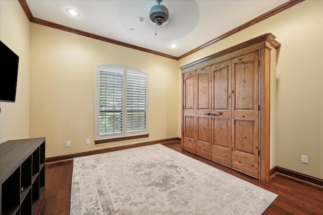 970 Hibiscus Cir, Beaumont, TX 77706 - unfurnished bedroom with dark wood-style flooring, crown molding, ceiling fan, and recessed lighting