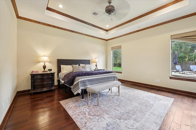 970 Hibiscus Cir, Beaumont, TX 77706 - bedroom featuring multiple windows, a raised ceiling, dark wood-style flooring, ornamental molding, and recessed lighting