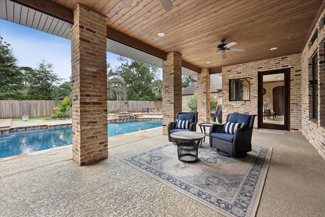 970 Hibiscus Cir, Beaumont, TX 77706 - fenced backyard featuring ceiling fan, a patio, and a pool with connected hot tub