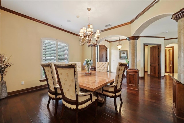 970 Hibiscus Cir, Beaumont, TX 77706 - dining space with arched walkways, dark wood finished floors, decorative columns, crown molding, and a chandelier
