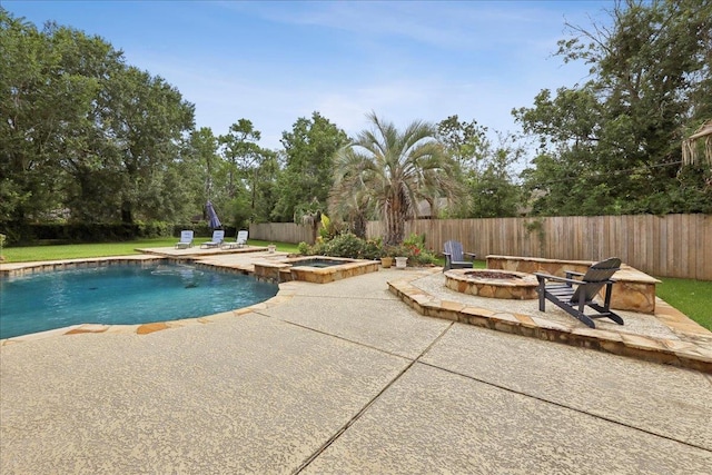 970 Hibiscus Cir, Beaumont, TX 77706 - view of swimming pool with an outdoor fire pit, a patio area, a fenced backyard, and a pool with connected hot tub