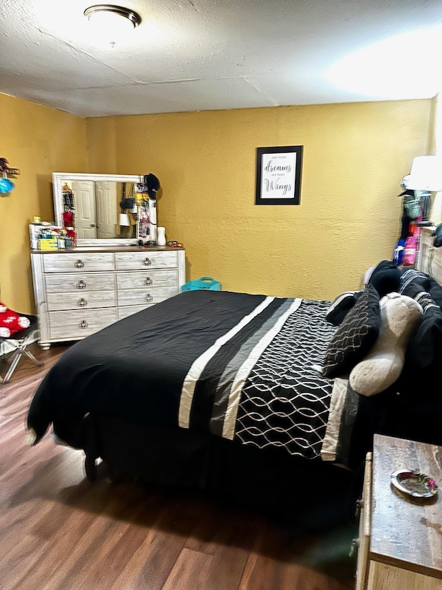 bedroom featuring dark wood-type flooring