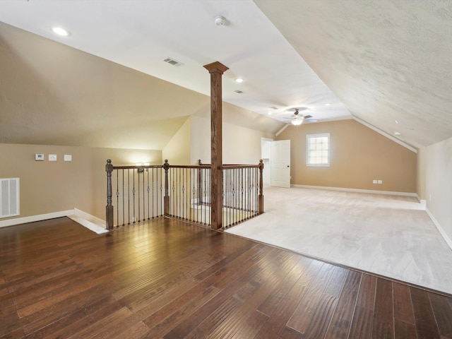 9670 Manion Ct, Beaumont, TX 77706 - additional living space with lofted ceiling, visible vents, baseboards, hardwood / wood-style flooring, and ceiling fan