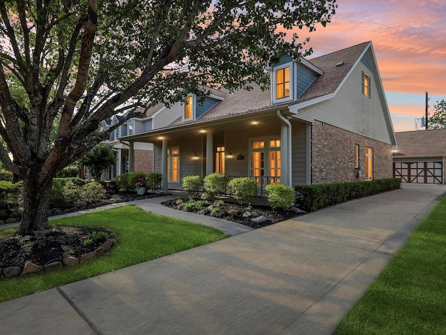 9670 Manion Ct, Beaumont, TX 77706 - view of front facade featuring a shingled roof, a yard, an outbuilding, brick siding, and a garage