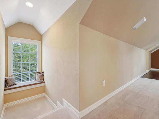 9670 Manion Ct, Beaumont, TX 77706 - additional living space featuring vaulted ceiling, carpet flooring, and baseboards