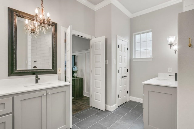 bathroom with tile patterned flooring, vanity, a notable chandelier, and ornamental molding