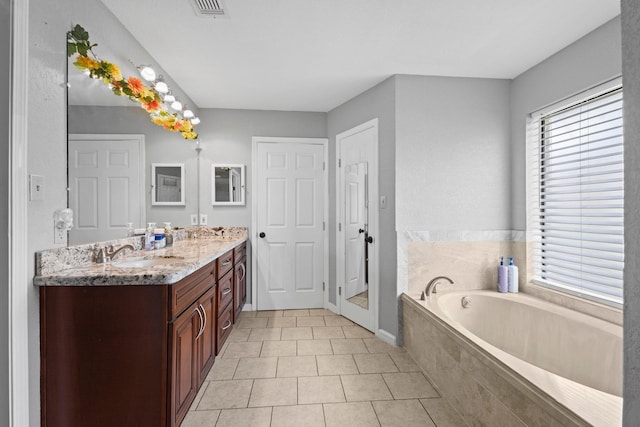 2515 Black Oak Dr, Orange, TX 77632 - bathroom featuring tile patterned floors, a garden tub, and vanity