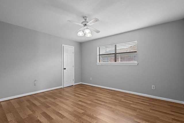 2515 Black Oak Dr, Orange, TX 77632 - spare room with wood finished floors, baseboards, and a ceiling fan