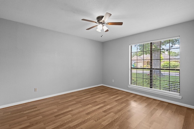 2515 Black Oak Dr, Orange, TX 77632 - unfurnished room featuring wood finished floors, baseboards, and ceiling fan